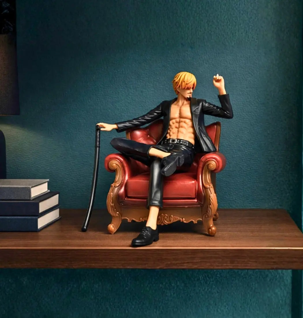 Sanji anime Action figure of a character sitting on a red chair with a cane, against a dark teal wall.