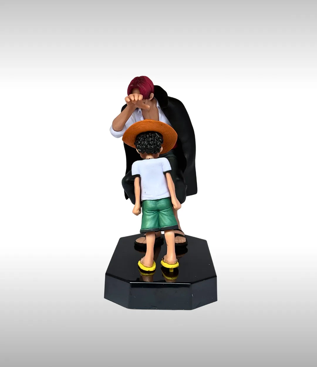 Figurine of a person with a child on a white background