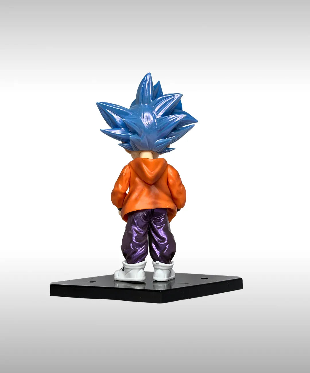 Super Saiyan Blue character figurine on a black base with a white background