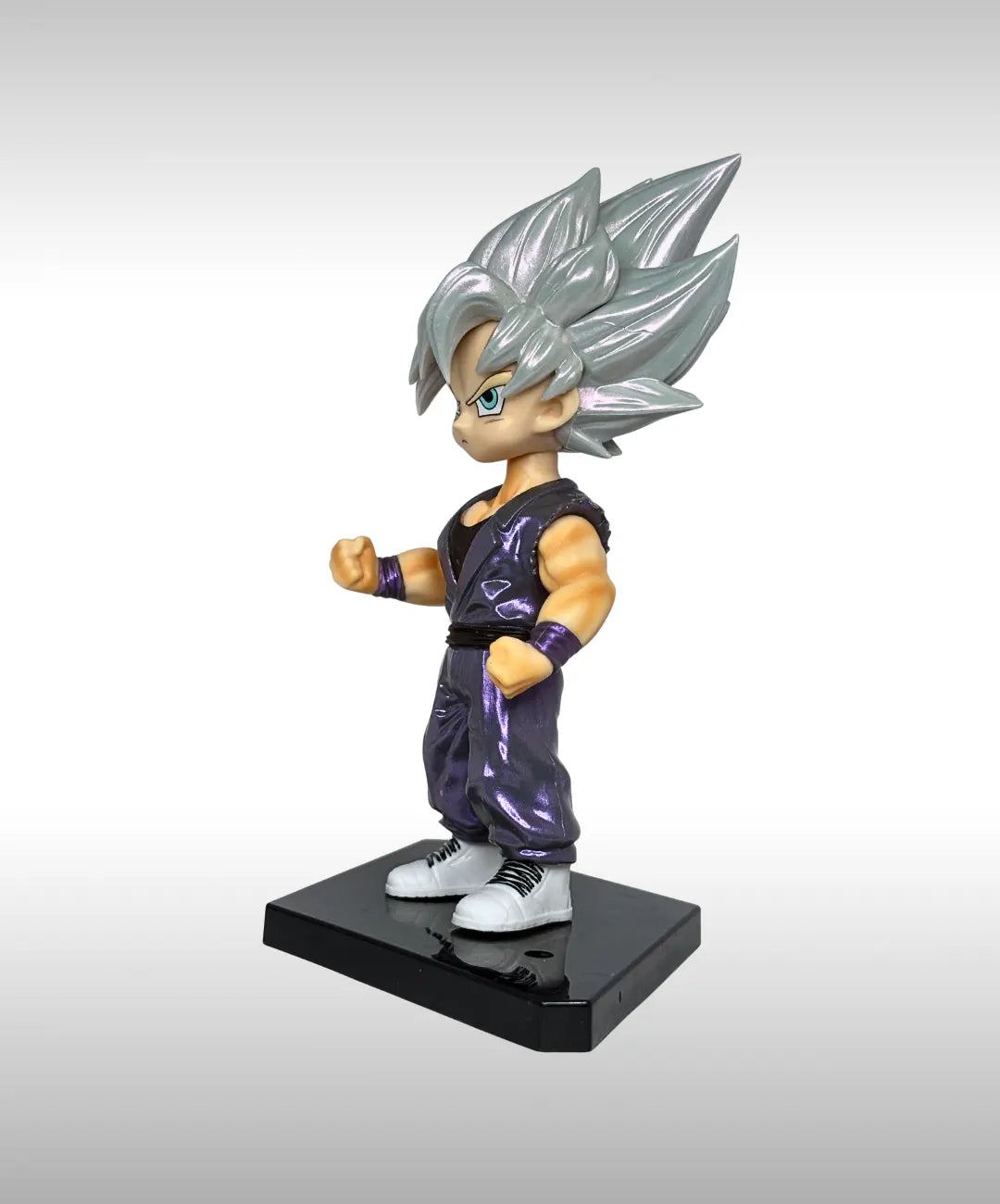 Figurine of a character with silver hair and purple outfit on a gray background