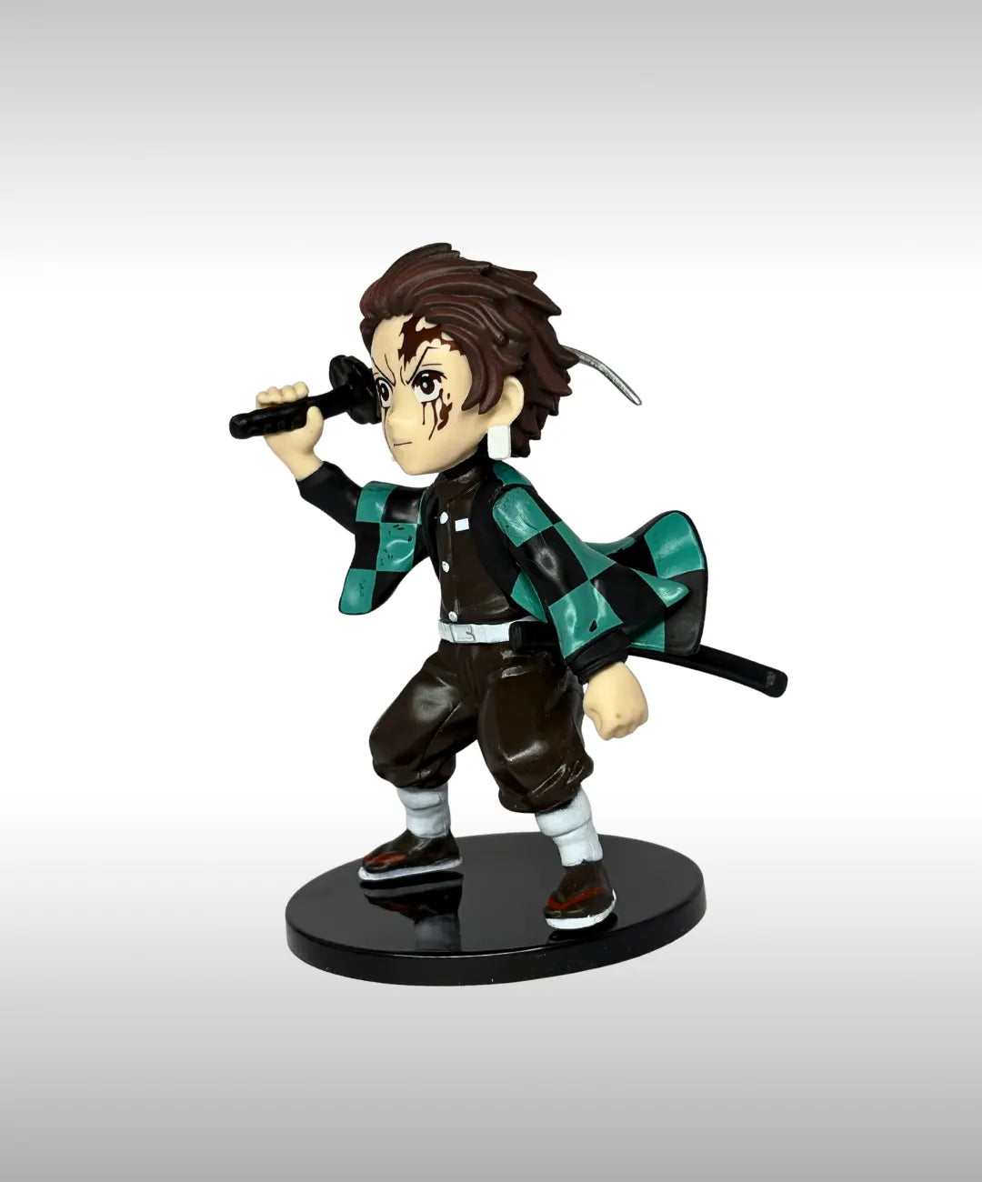 Action figure of a character with a checkered outfit and sword on a white background