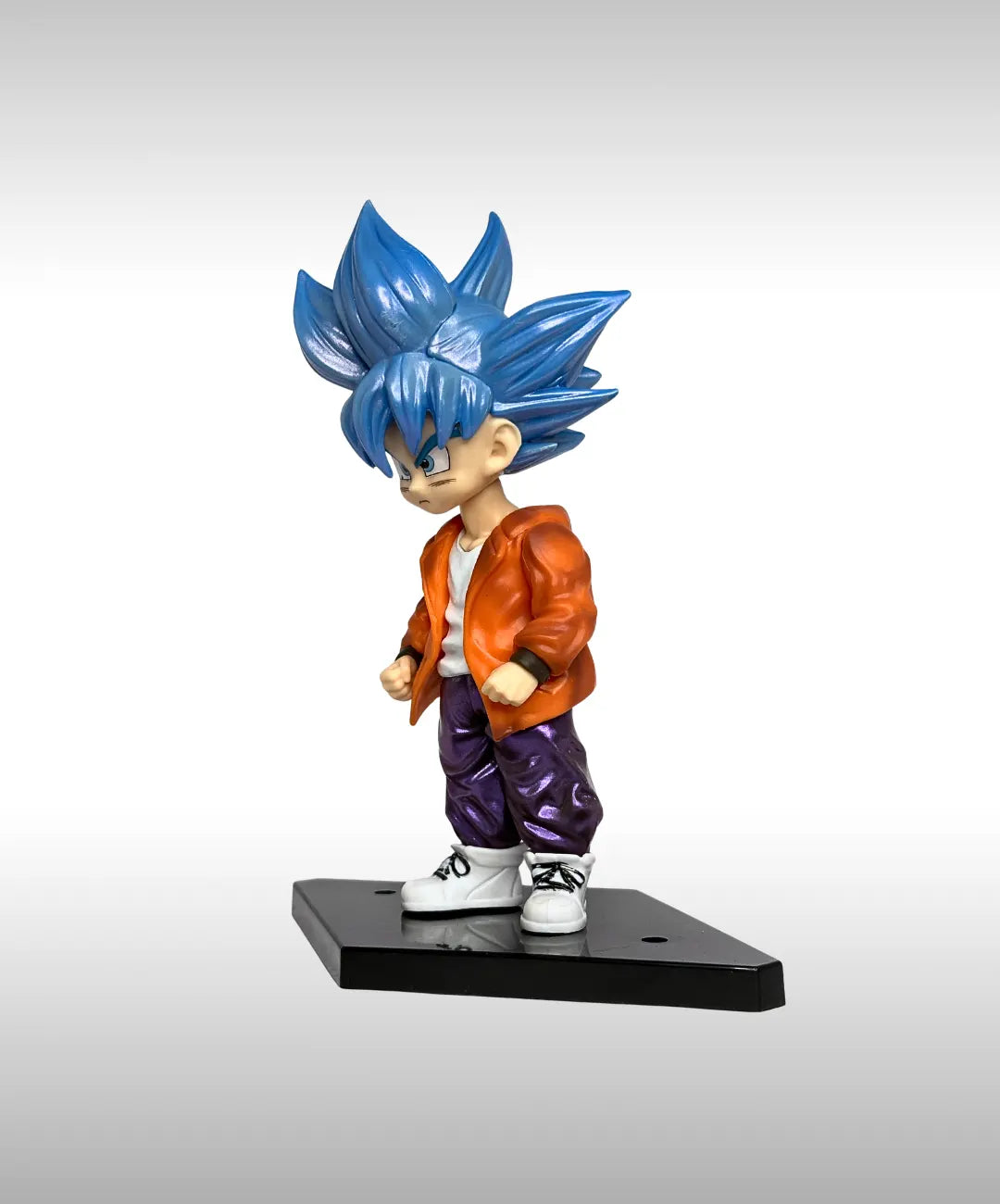 Figurine of a character with blue hair and orange jacket on a gray background