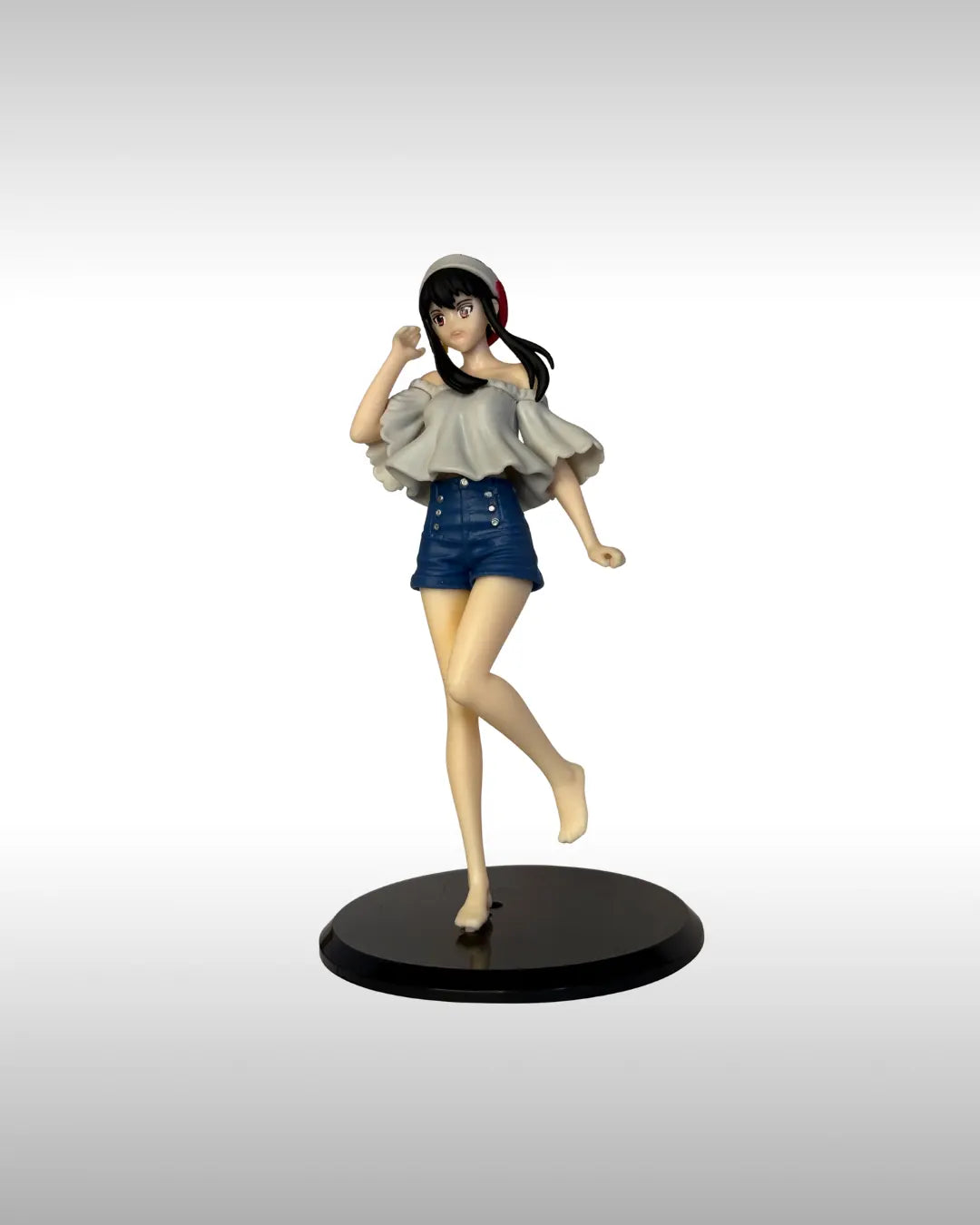 Figurine of a character in casual clothing on a gray background