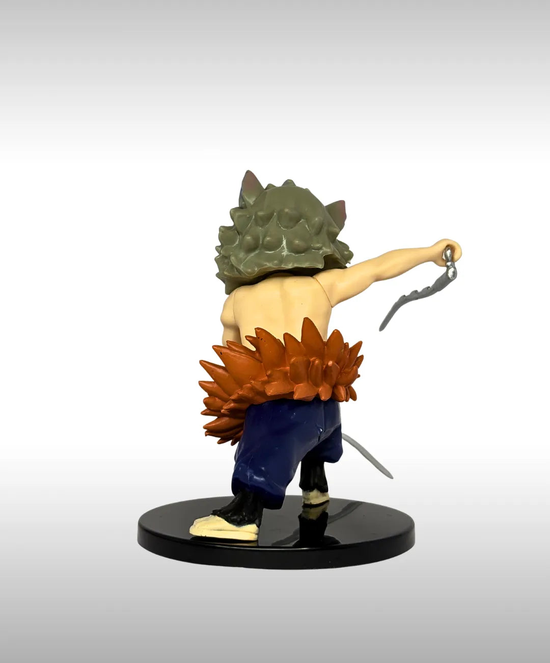 Action figure with a green helmet and orange hair on a white background